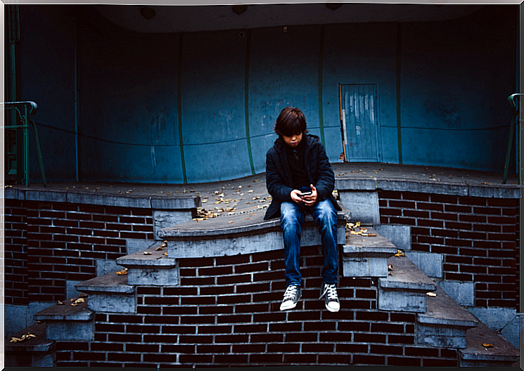 Child sitting outside alone