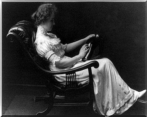 Helen Keller in a chair