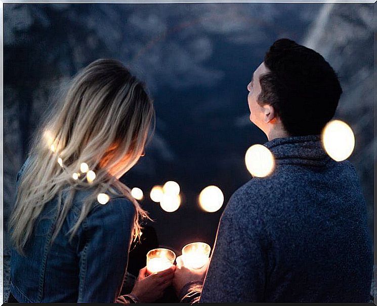 A couple surrounded by candles