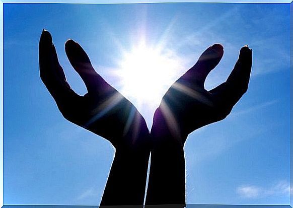 Hands embrace the sun