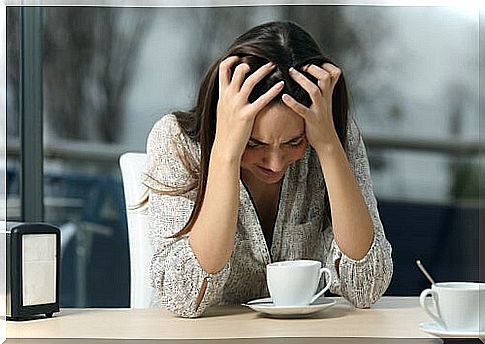 Woman Sitting Angry Bent Over Out of Uncontrolled Anger