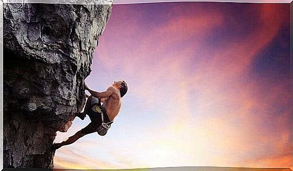 Man climbing a mountain