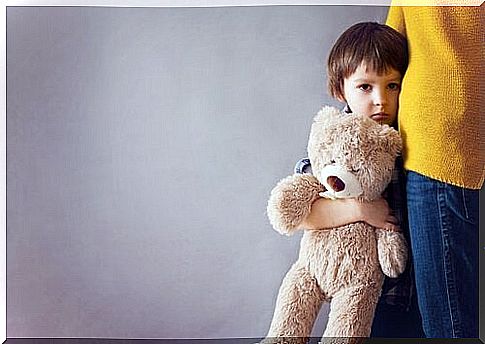 Boy holding his mother's hand